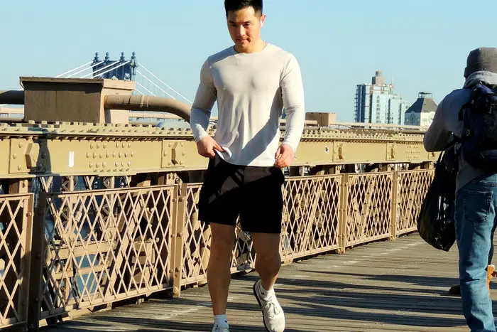 a jogger on the Brooklyn Bridge